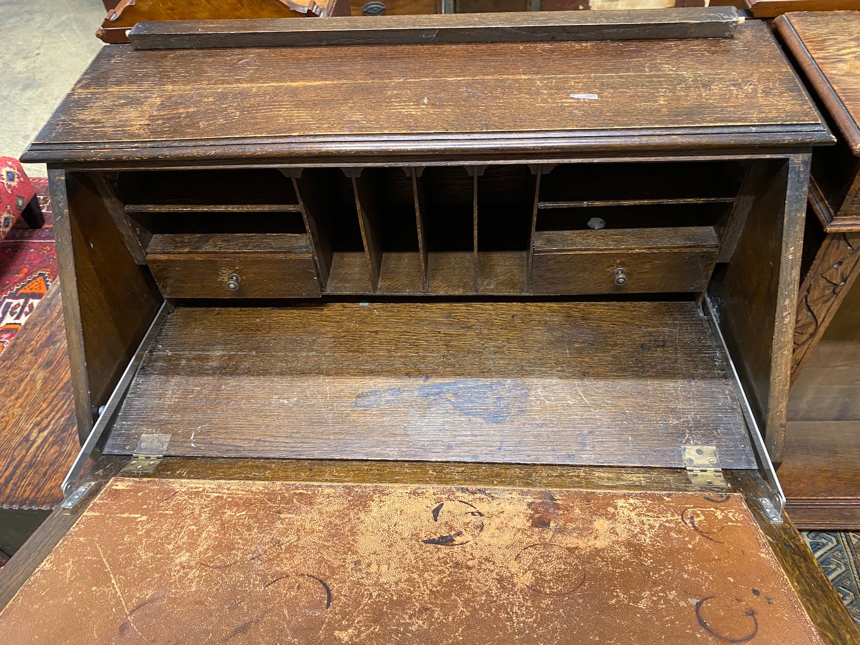 An 18th century style carved oak bureau, width 87cm, depth 47cm, height 106cm